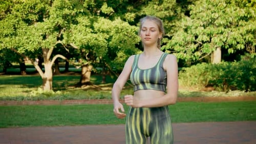 Sport Outdoor Young Fit Sporty Woman Stretching Her Body Warm Up Before Workout at Public Park