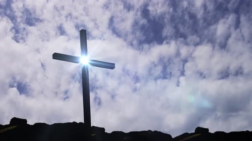 Symbolic Cross Silhouette Against a Bright Sky