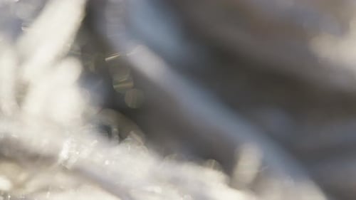 video showing textures and pile of a rug, Treads and strands close up.