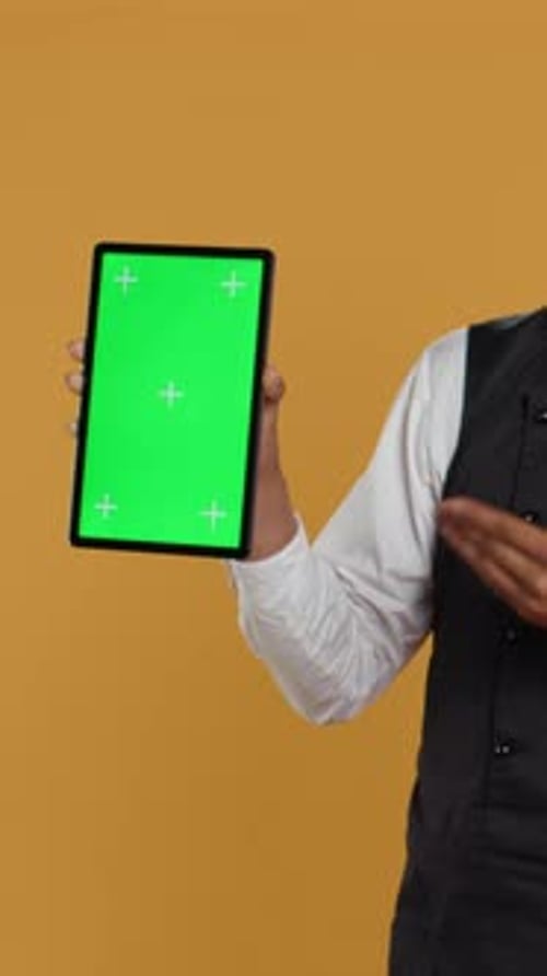Vertical Video Waiter Showing a Tablet with Isolated Copy Space in Studio