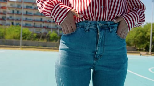 Stylish Person Wearing Jeans and Striped Blouse