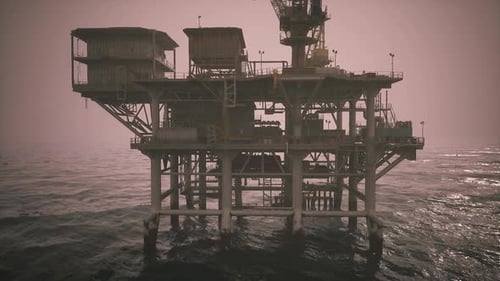 Oil Rig Operating in Offshore Waters During Twilight Hours