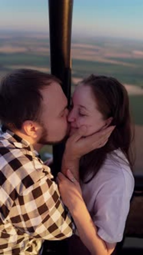 Romantic Couple Kissing in a Hot Air Balloon