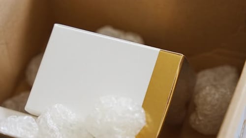 Eco Packaging of Parcels and White Biodegradable Filler Box is Filled with a Filler Safety for