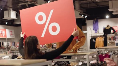 Woman Seller Install Red Percent Off Label Sale Hands of Mannequin Clothes Store