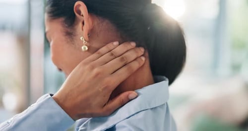 Woman Massaging Neck with Visible Strain