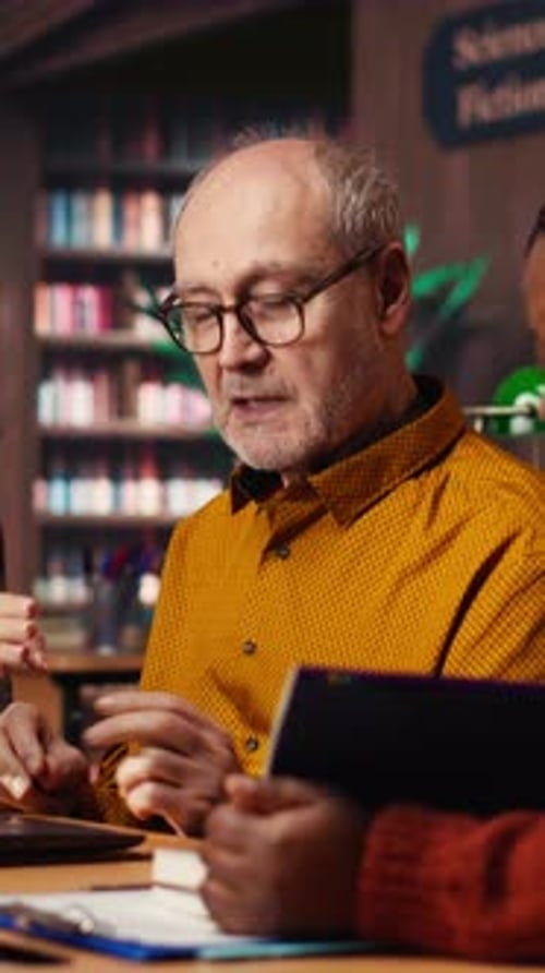 Vertical Video Mature Diverse Colleagues Writing Notes and Ideas in Campus Study Room