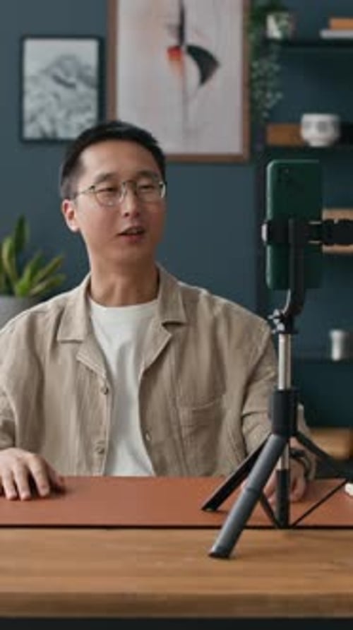 Man Talks to Camera Phone on a Tripod