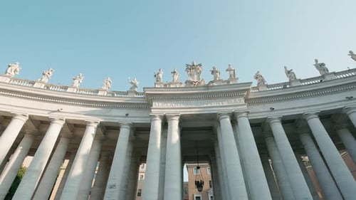 St Peter's Square Colonnade with Statues and Columns Under Clear Sky in Vatican City Rome Italy