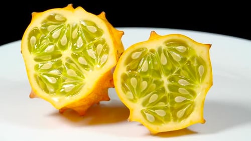 Kiwano Fruit or Horned Melon Exotic Fruits Rotating Close up. Fresh Juicy African Horned Cucumber