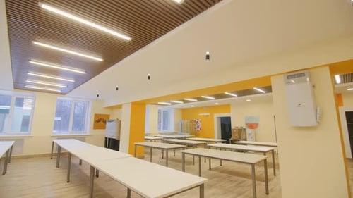 Empty Tables Arangement in Light Room of Office Building