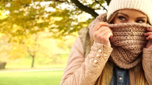 Girl in Knit Scarf in Golden Autumn Park
