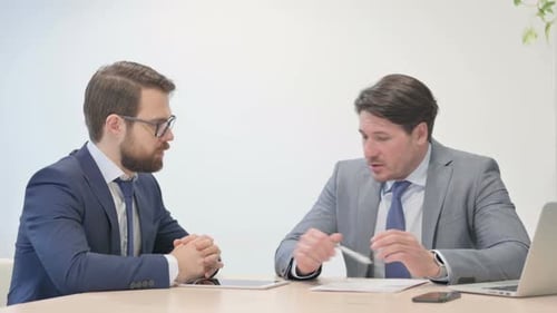 Business Meeting Ends in Handshake at Office