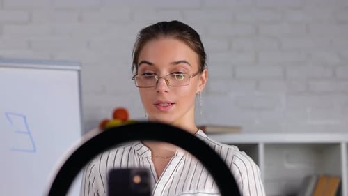 School Math Female Teacher Having Online Class Using Smartphone with Tripod Smart Young Woman in