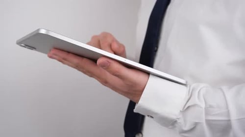 Man Using Silver Tablet, Close Up
