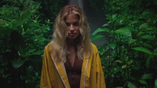 Blonde Girl Exploring Waterfall in Bali Indonesia Woman in Yellow Raincoat Enjoying Vacation Trip