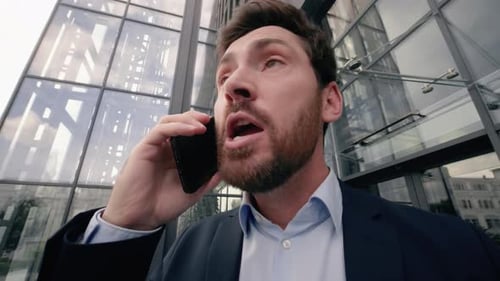 Man in Suit Angrily Yelling into Phone