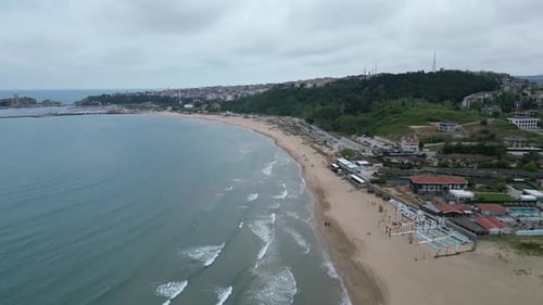 Flying over the junction of sand and sea on the beach