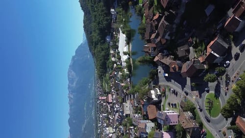 View of the Swiss city Werdenberg. Swiss Alps in the background. Roofs of houses
