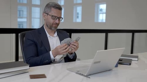 Easy Money Excited Businessman Counting Dollars in Office Rich Man in Suit with Dollars Office