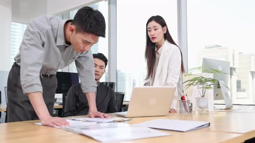 Teamwork Makes the Dream Work: Creative small busineness team collaborates in modern office meeting,