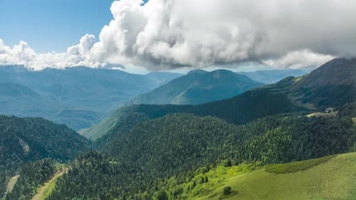 Flight Over Green Fields Hills and Mountains