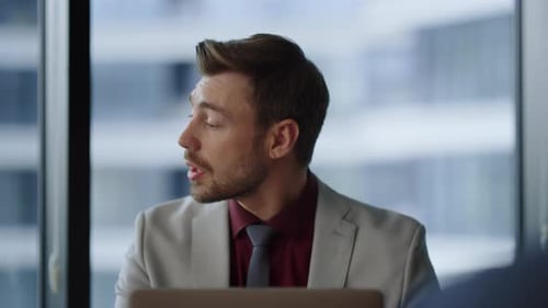 Focused Ceo Man Working Using Laptop Looking Computer Screen in Financial Building