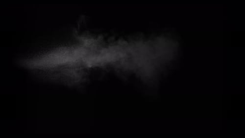 Sahara Collection: A small sand stream exploding from the bottom side and scattering slowly at the e