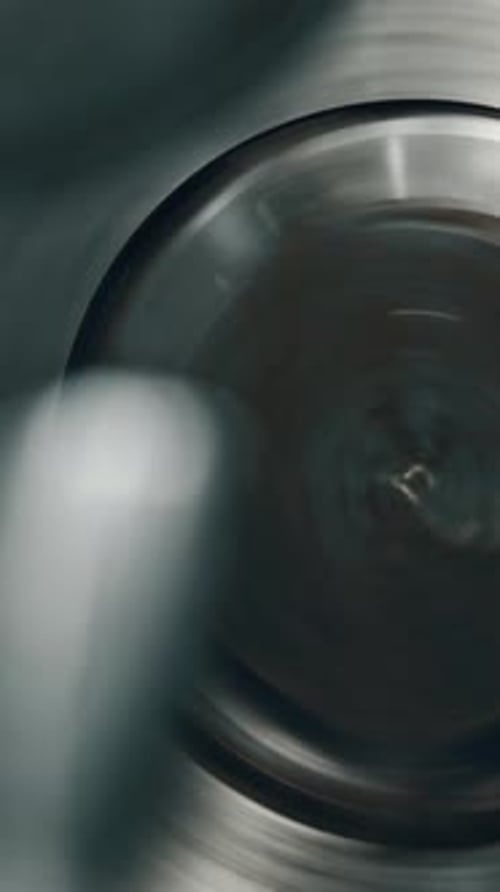 Precision metal lathe in action spinning part for machining process