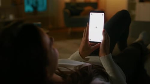 Woman Using Phone with Chroma Key at Night