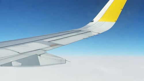 Aerial View Through Airplane Window in the Morning Travel By Air