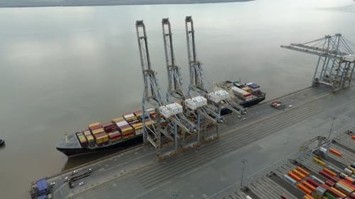 Aerial view of cargo ship at dock, United Kingdom.