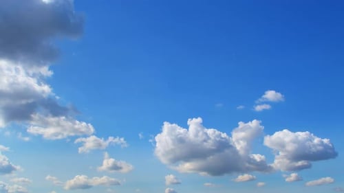 Clouds Drifting Across a Deep Blue Sky