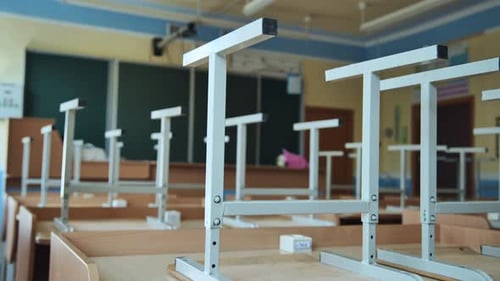 The Concept of Graduating From High School Upsidedown Chairs in an Empty Classroom at the School