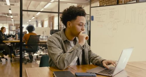 Portrait of Generation Z Businessman in Office Looking at camera