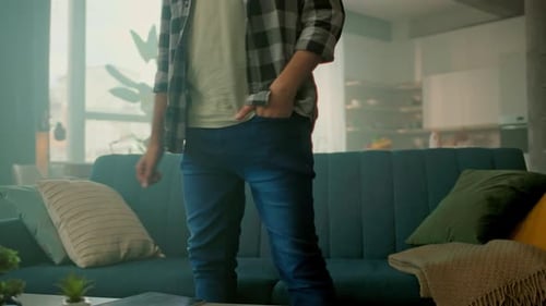 Man Relaxes at Home, Using Tablet