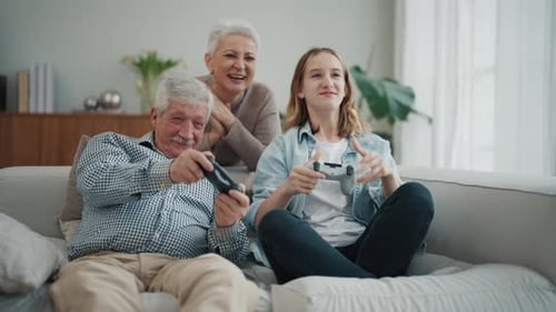 Happy Family Playing Video Games Together at Home