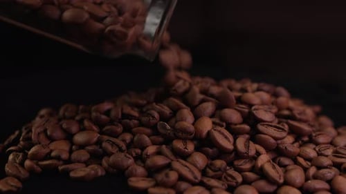 Coffee Beans Poured from Jar in Close Up