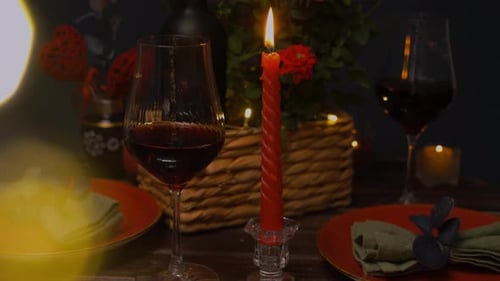 Romantic Candlelit Table Setting with Wine Glasses