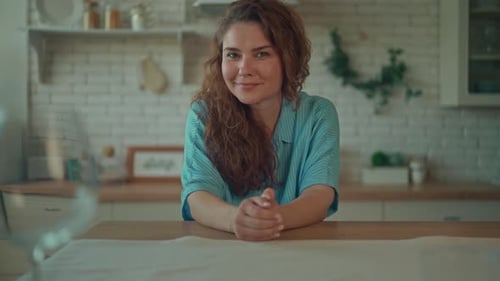 Smiling Woman Posing in Her Kitchen