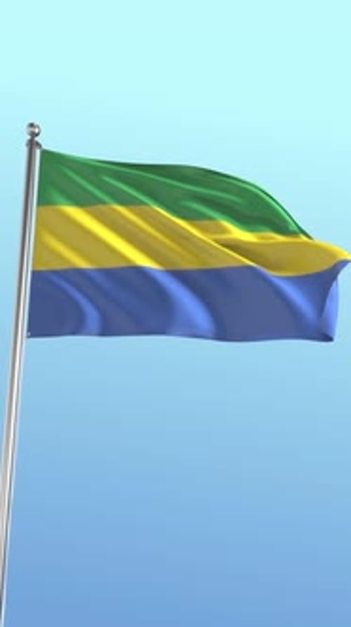 Realistic Gabon National Flag Waving Against Blue Sky
