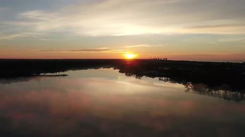 Morning Sunrise at Powell Lake, Florida. Colorful Sky and mirror like lake.