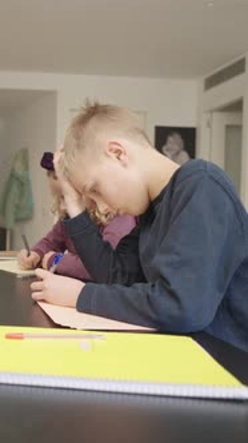 Children Doing Schoolwork at Home