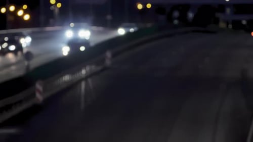 Night traffic on the road and moving cars. Blurred bokeh background for use as green screen backgrou