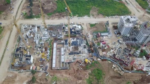 Large residential construction site with cranes, Aerial view