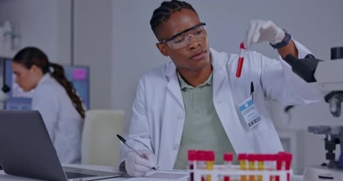 Science, chemistry and writing with black man in laboratory for medical, research and pharmacy