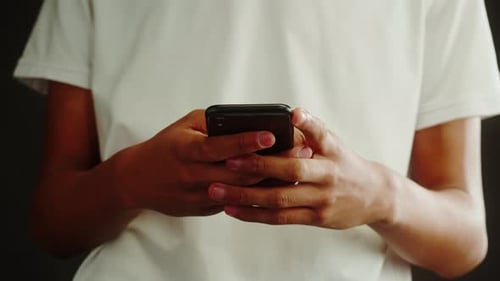 Person Using Mobile Phone Device At Home