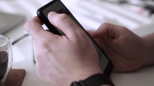 Man scrolling social media in smartphone