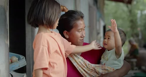 Thai or Asian woman which is a single mother working as a farm laborer in rural area