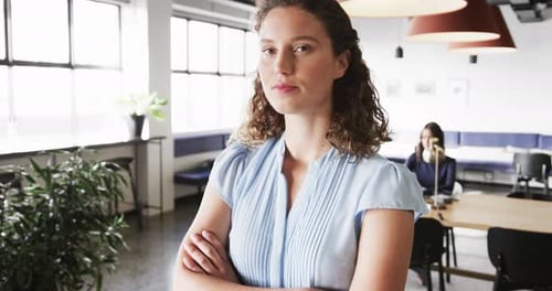 Portrait of happy caucasian casual businesswoman in office, slow motion